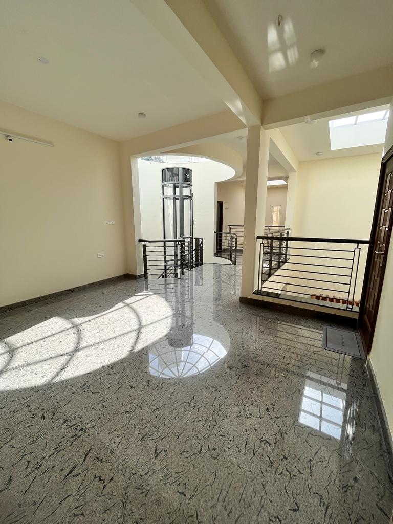 Sunlit upper gallery at Saptha Sagara Villa