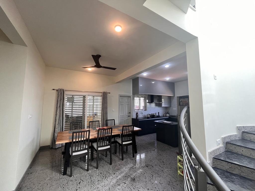 Connected dining and kitchen at Saptha Sagara Villa
